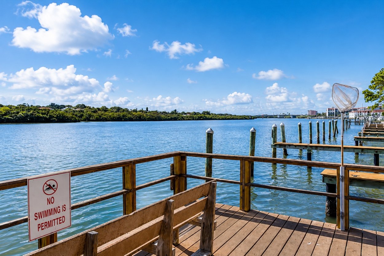 The wooden dock reaching out over the Intracoastal Waterway, with boat slips beyond